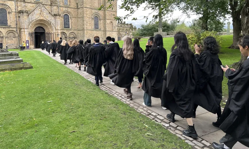 Students walking towards Durham Cathedral's North Door during Matriculation