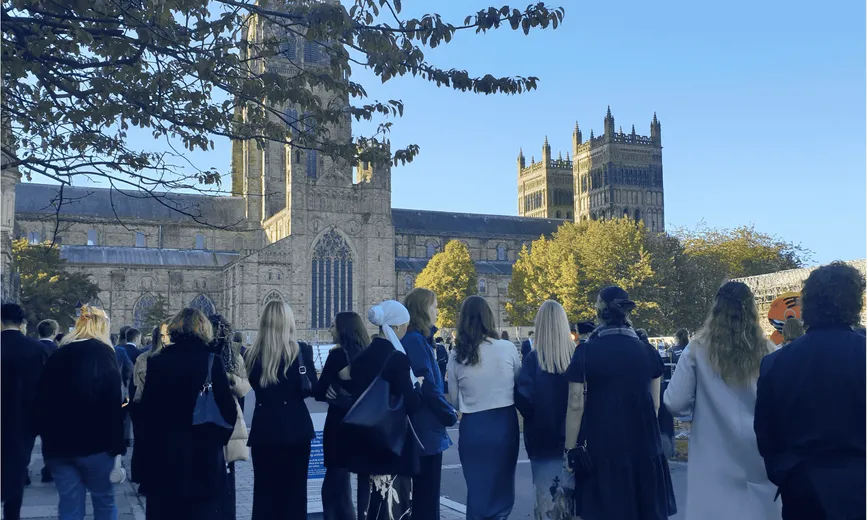 A group of students stood in front of Durham Cathedral