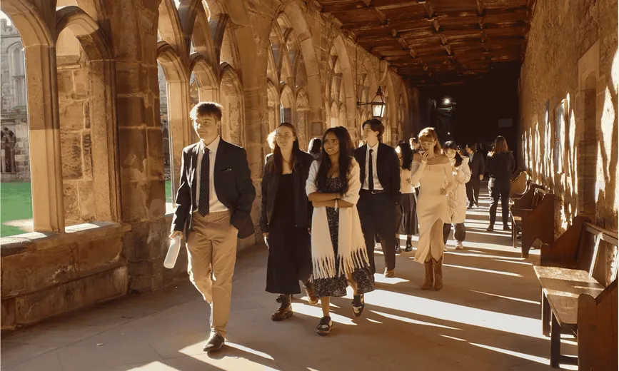 Students walking through Durham Cathedrals Cloisters