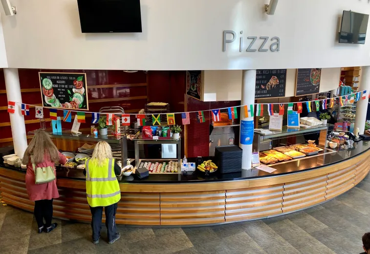 Two people stood at the counter