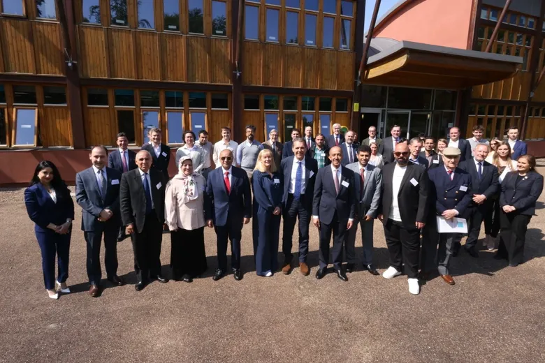 Delegates of the IMEIS conference gathered outside the Al Qasimi Building, Durham, UK