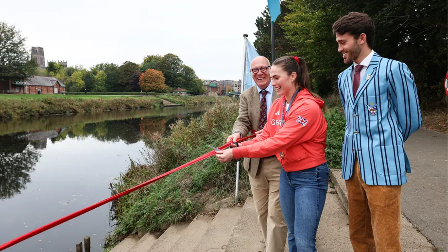 Lauren Irwin cuts the ribbon to officially open the new landing stage at the College of St Hild and St Bede’s Boat Club, Durham University