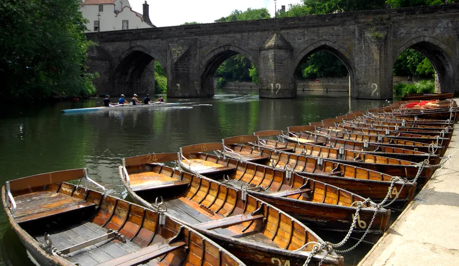 Rowing boats moored on the banks of the River Wear