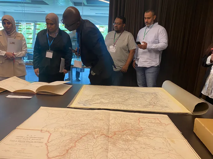 Participants at workshop looking at map