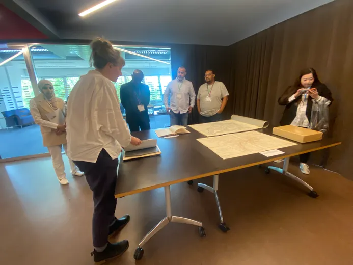 Participants at workshop looking at map