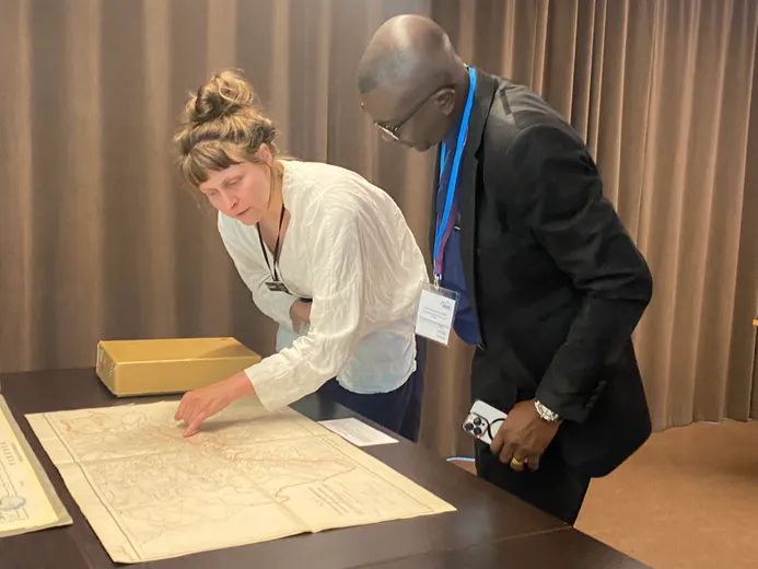 Participants at workshop looking at map