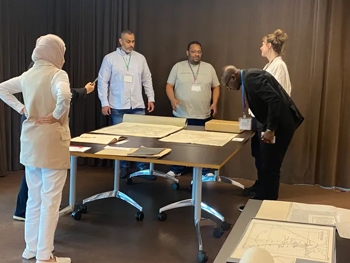 Participants at workshop looking at map