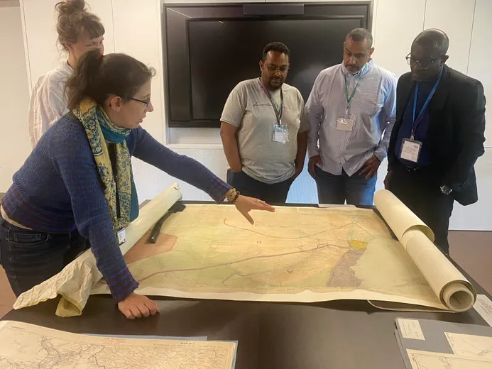 Participants at workshop looking at map