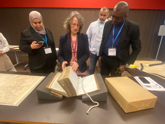 Participants at workshop looking at map