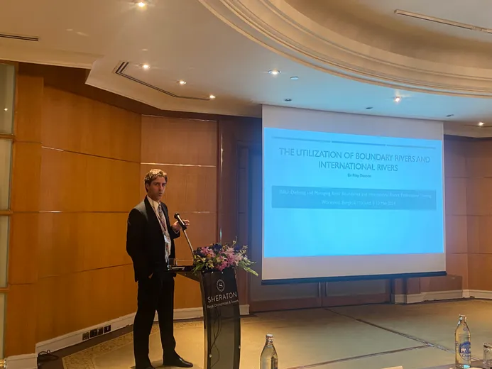 Riley Denoon speaking at IBRU workshop