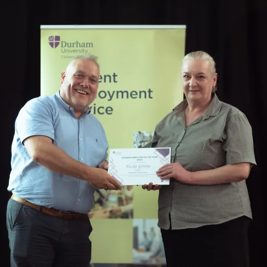 Nicola accepting her award certificate