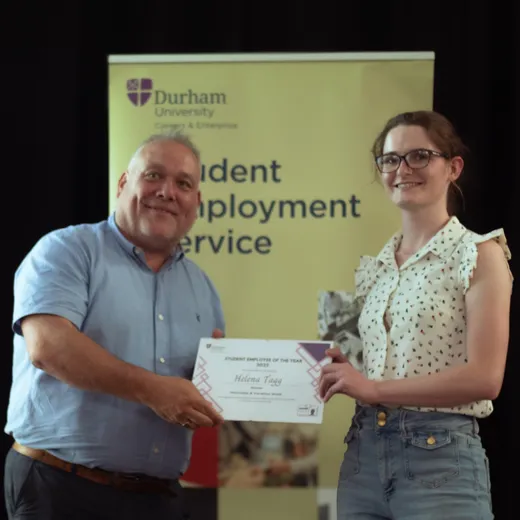 Helena accepting her award certificate.