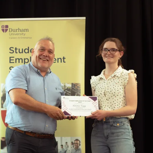 Helena accepting her award certificate