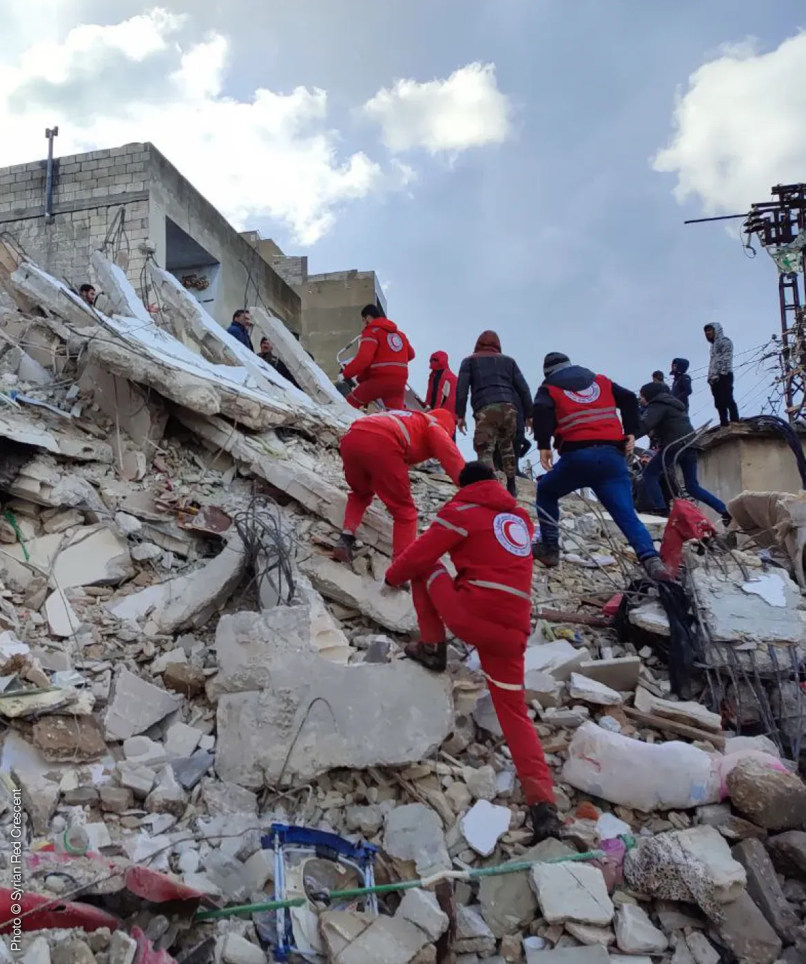 Rescuers on rubble
