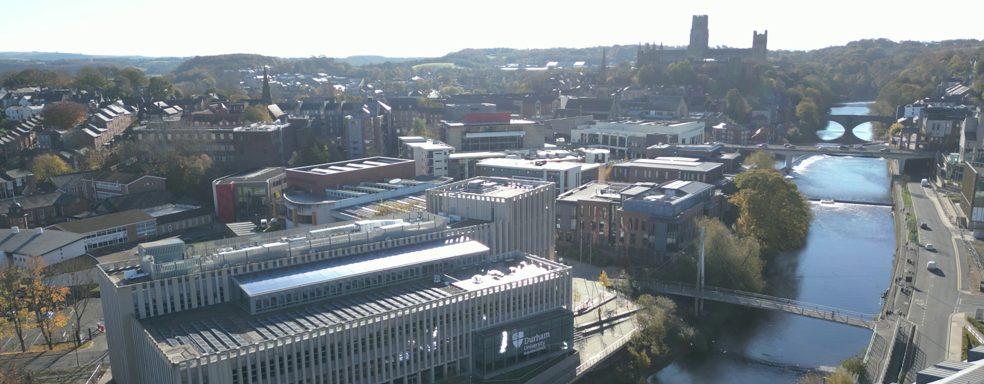 Waterside building with Durham City backdrop