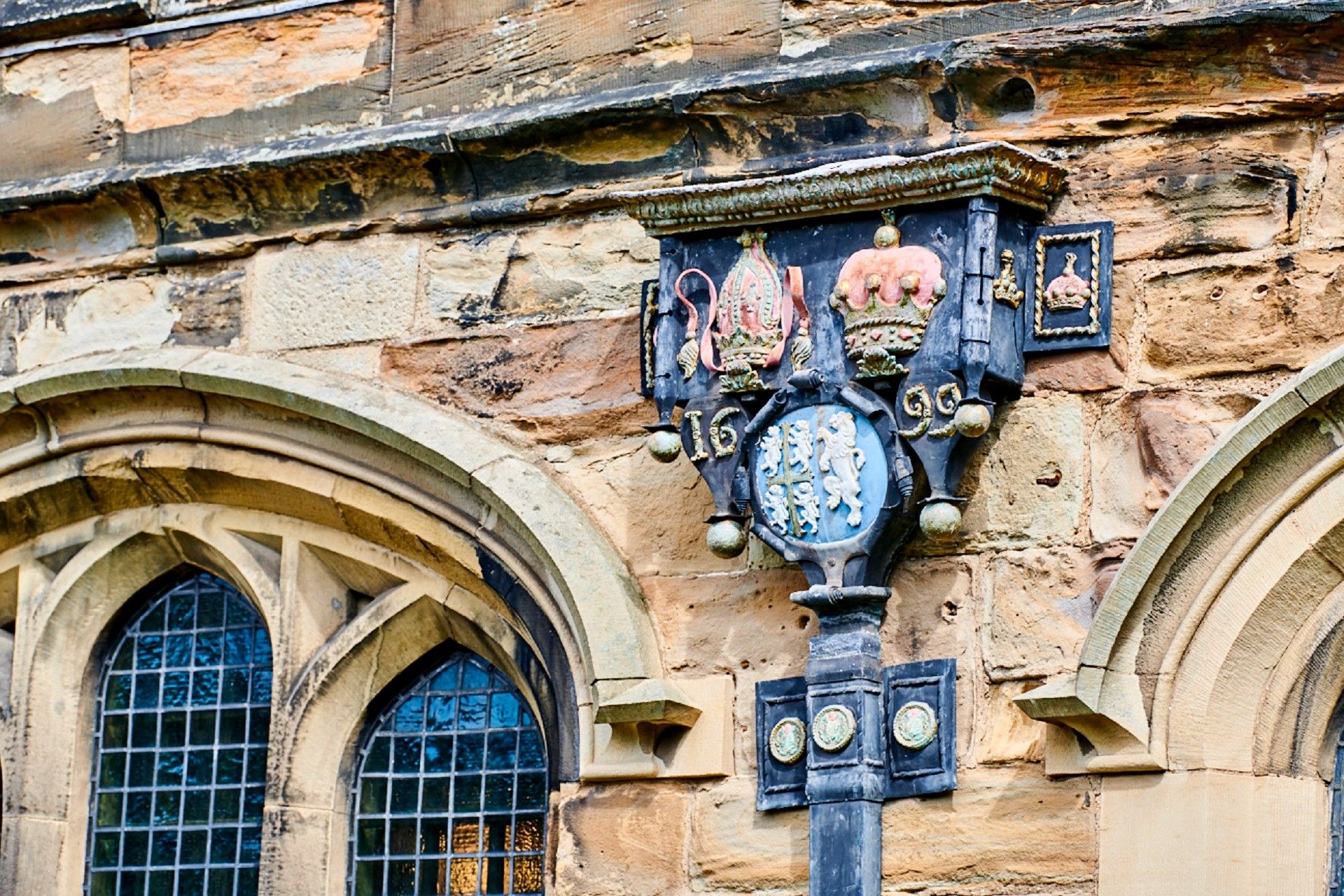 An ornate drainpipe on the Tunstall Chapel. The date 1699 can be seen as well as the coat of arms of the Bishop of Durham.