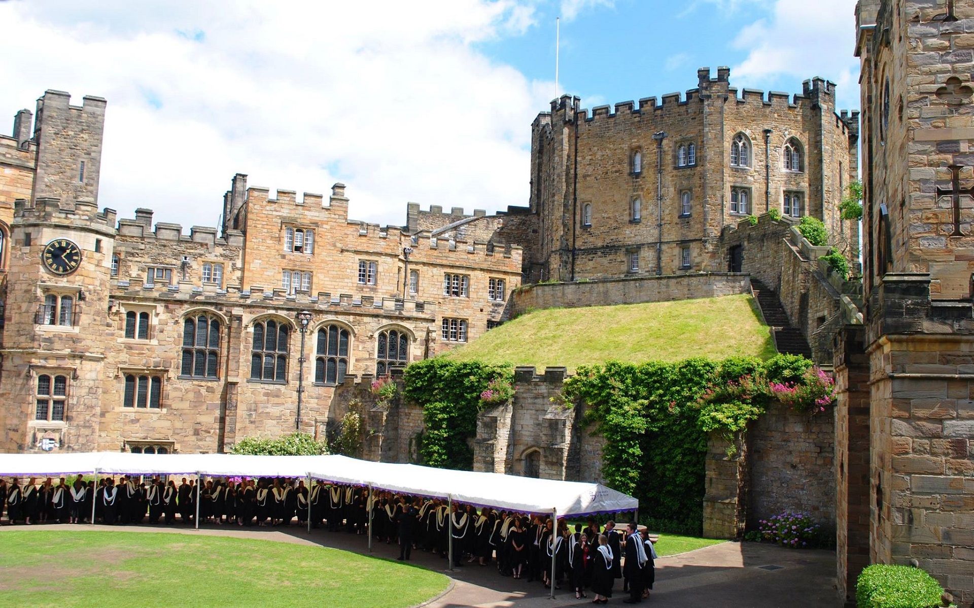 Photograph of the Keep of Durham Castle from the Courtyard, on the right is the Gatehouse, at the top right is the Keep and then on the left the Tunstall Gallery, Chapel and Tower.