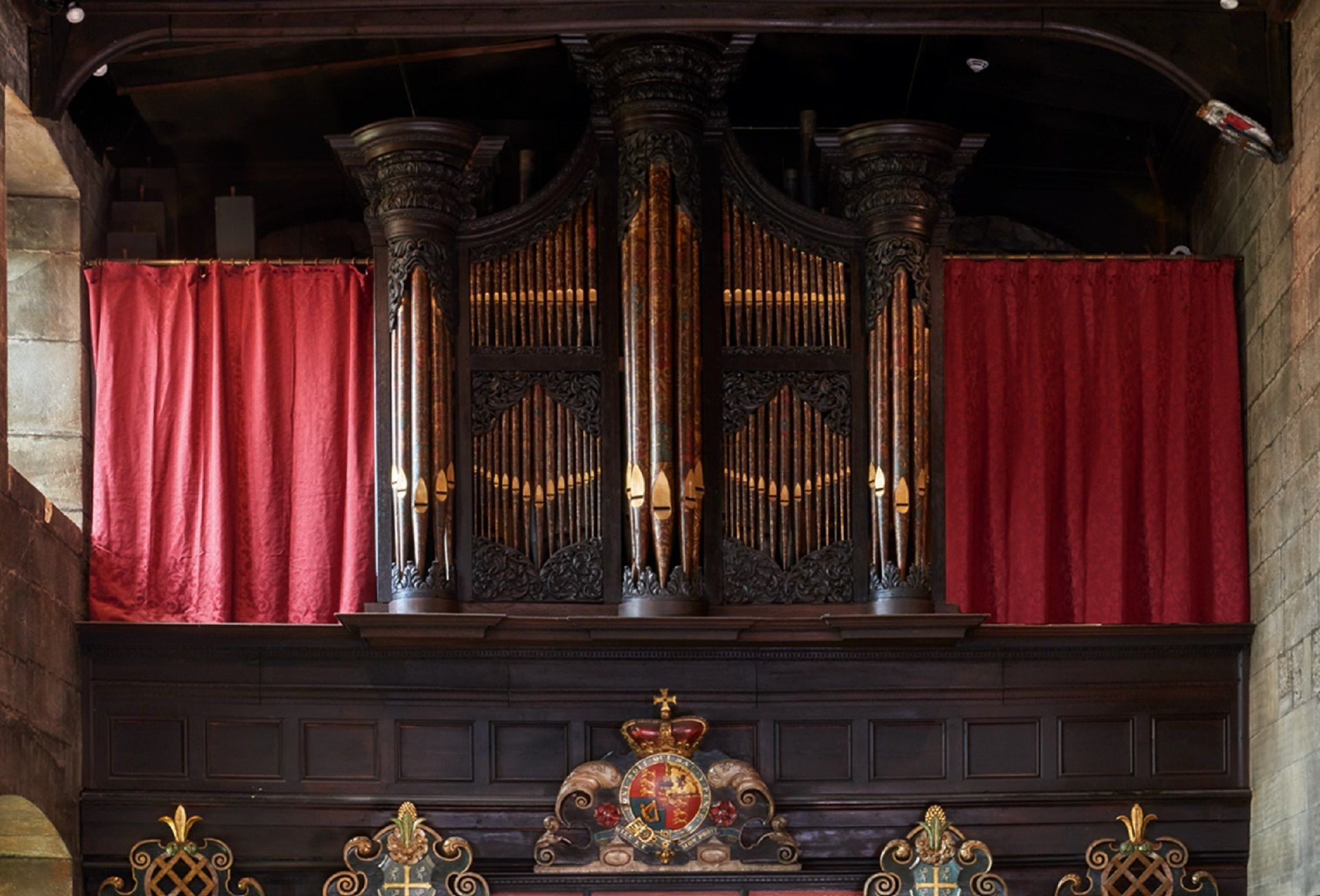 The 17th organ in the Tunstall Chapel. Looking west, the organ is above the 17th century wooden screen.