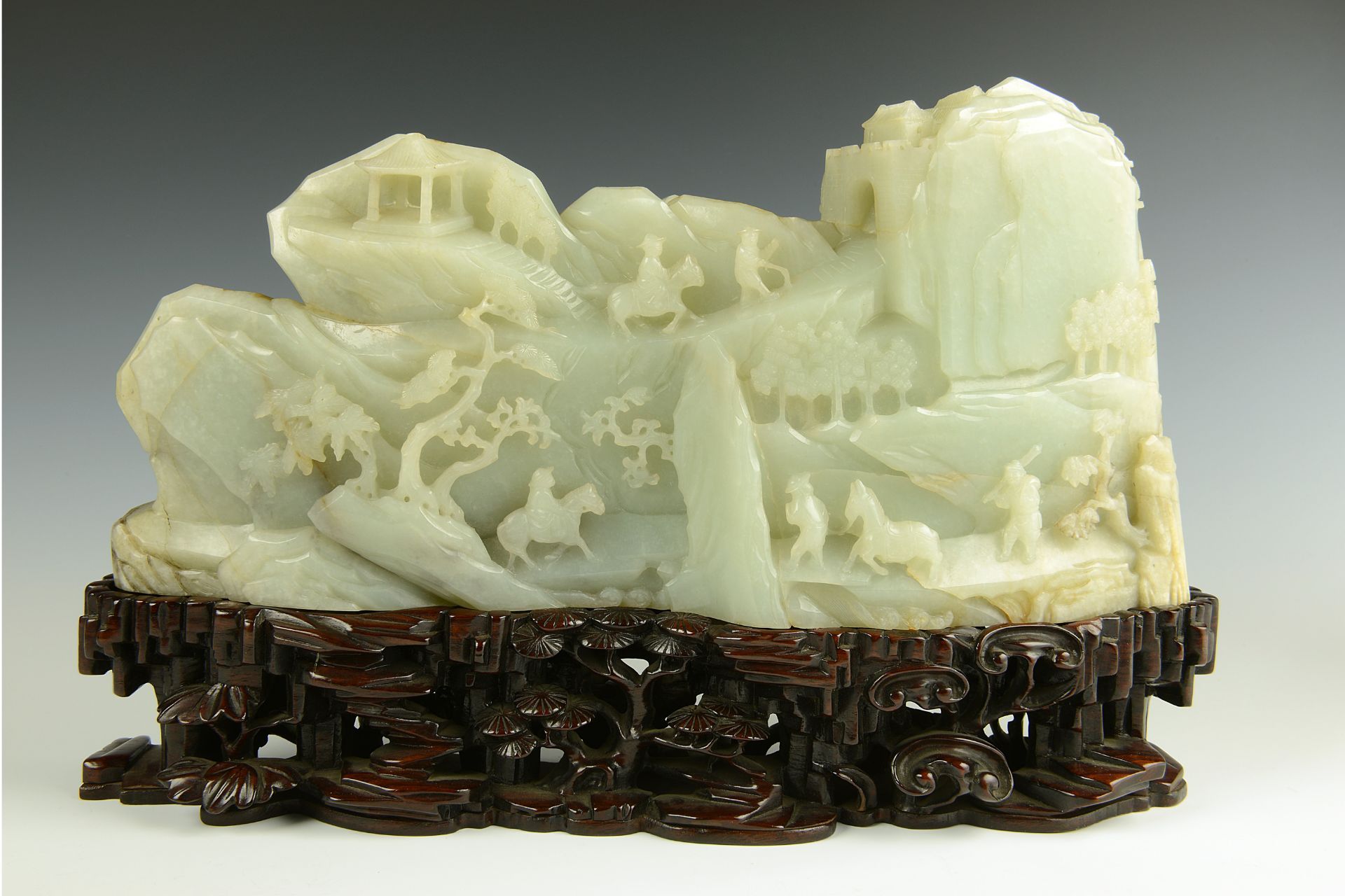 Qing dynasty jade mountain on wooden stand