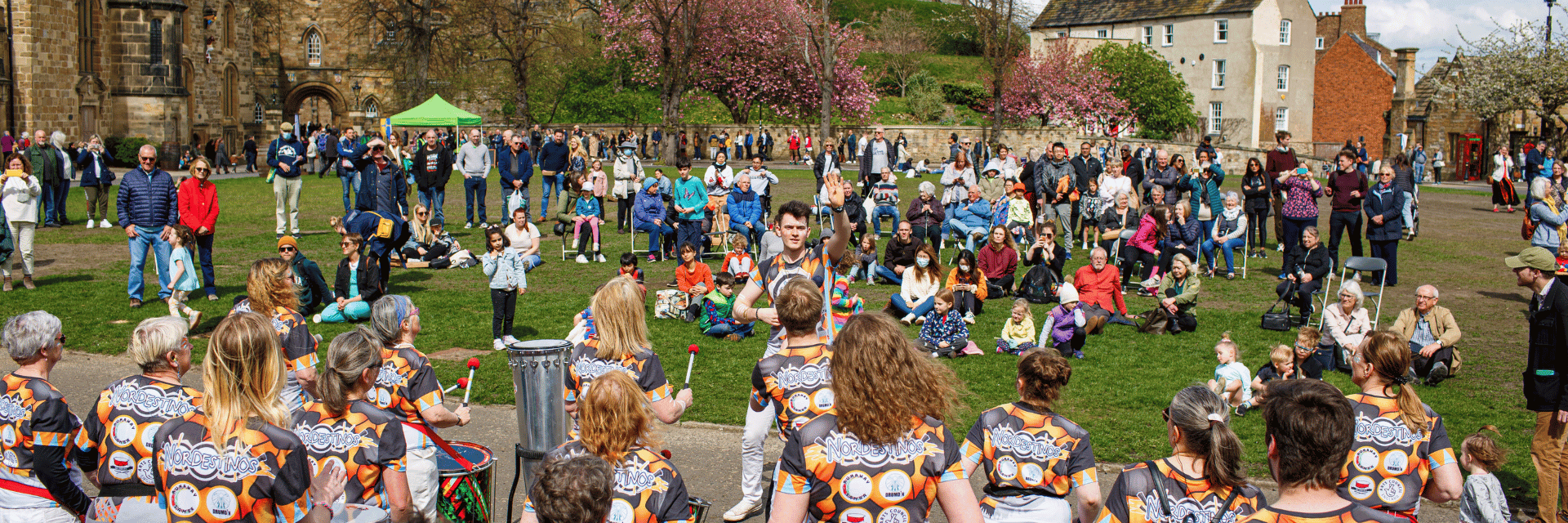 A crowd watching a group of drummers