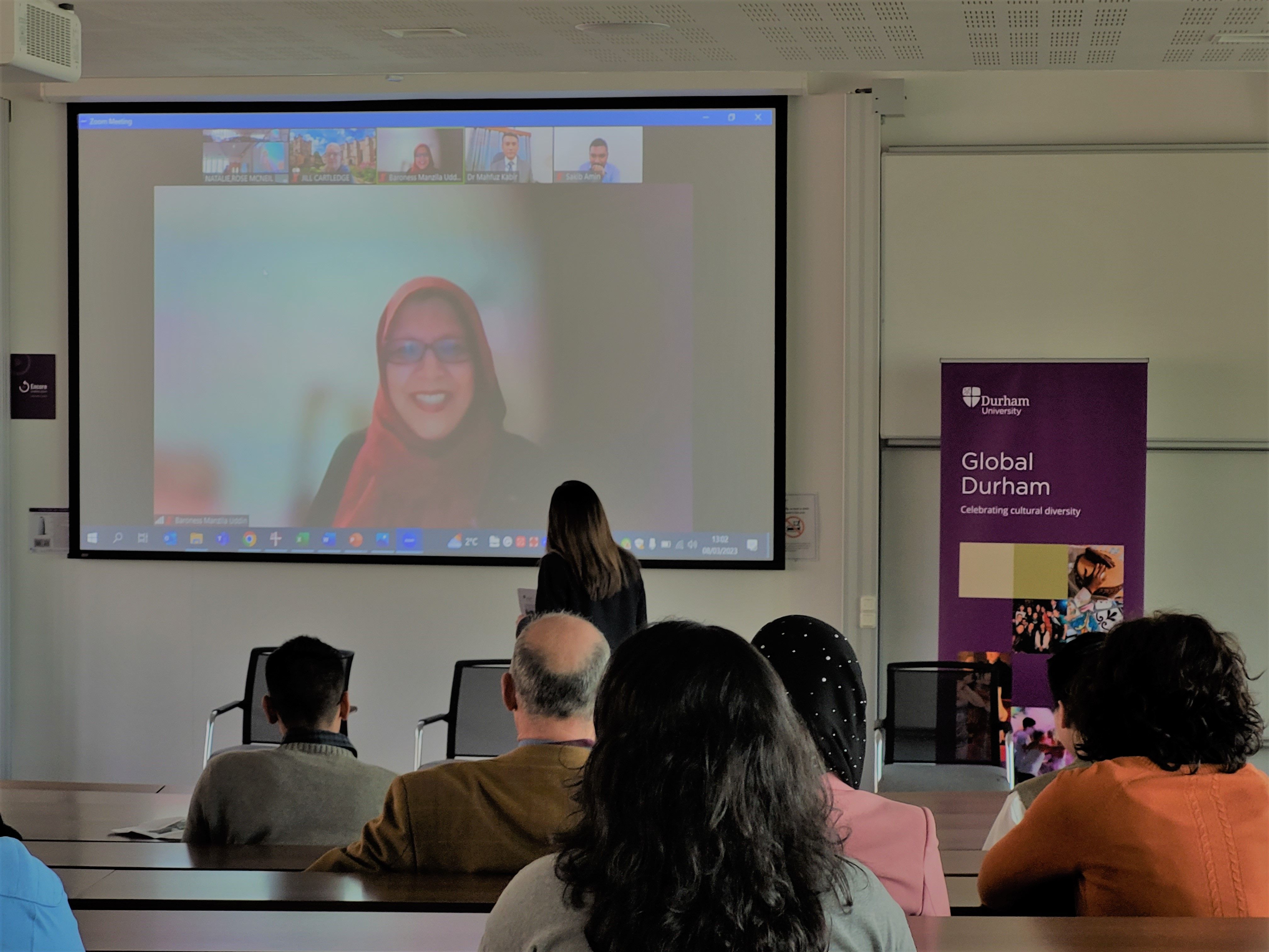 A speaker joins the Fixing our Climate The Bangladesh Perspective remotely. The event was hybrid, allowing speakers and audience members to join in person or online.