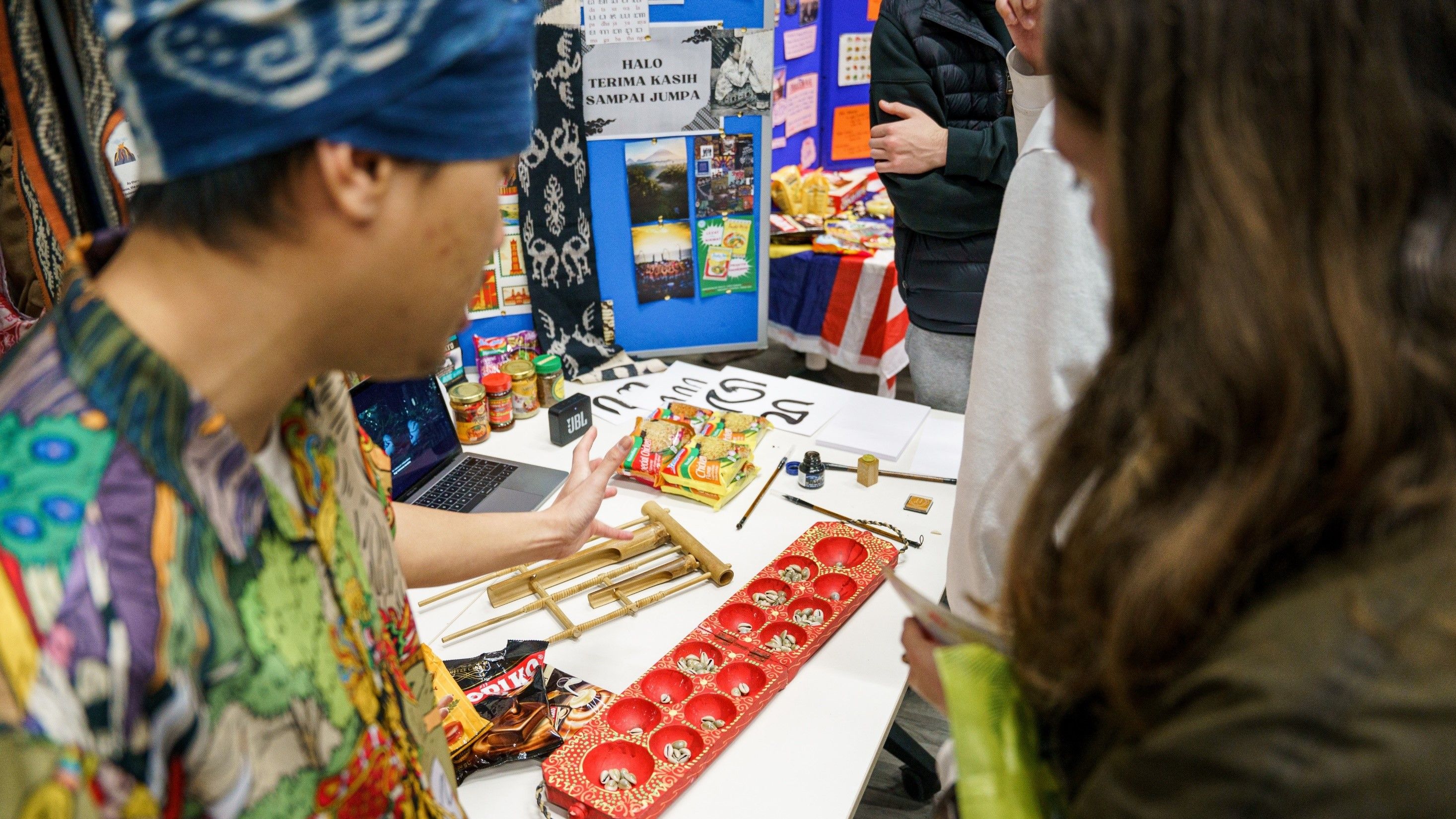 Students learning about Indonesia, one of many countries represented by a stall at World Fest