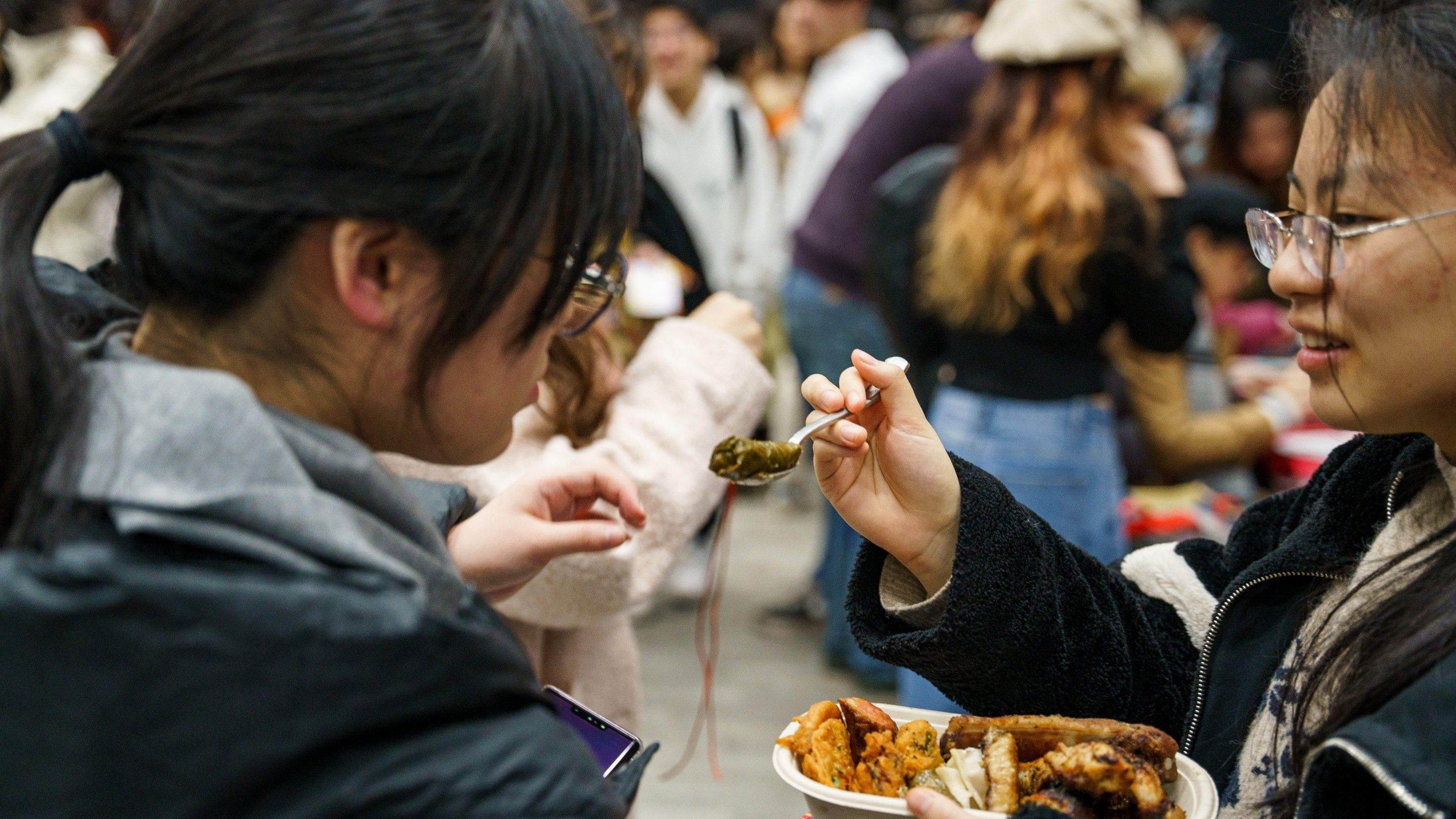Students trying a variety of foods from around the globe at World Fest