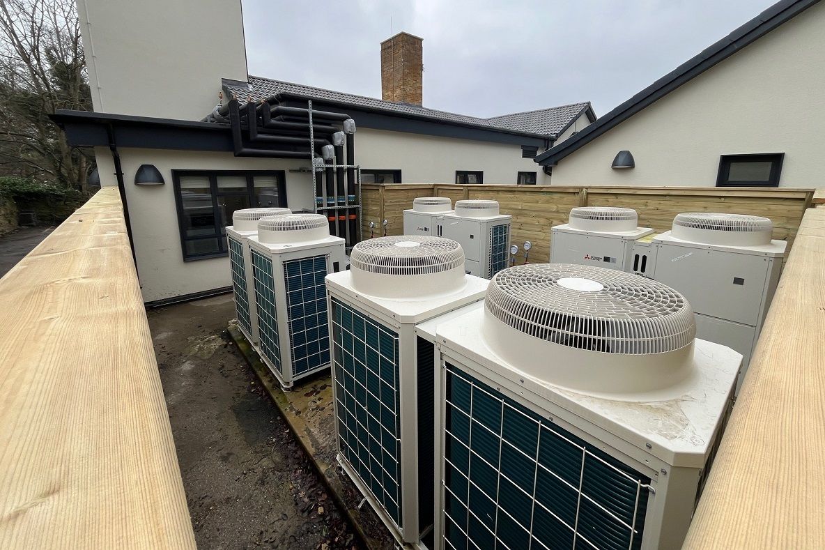 Heat pumps beside a building