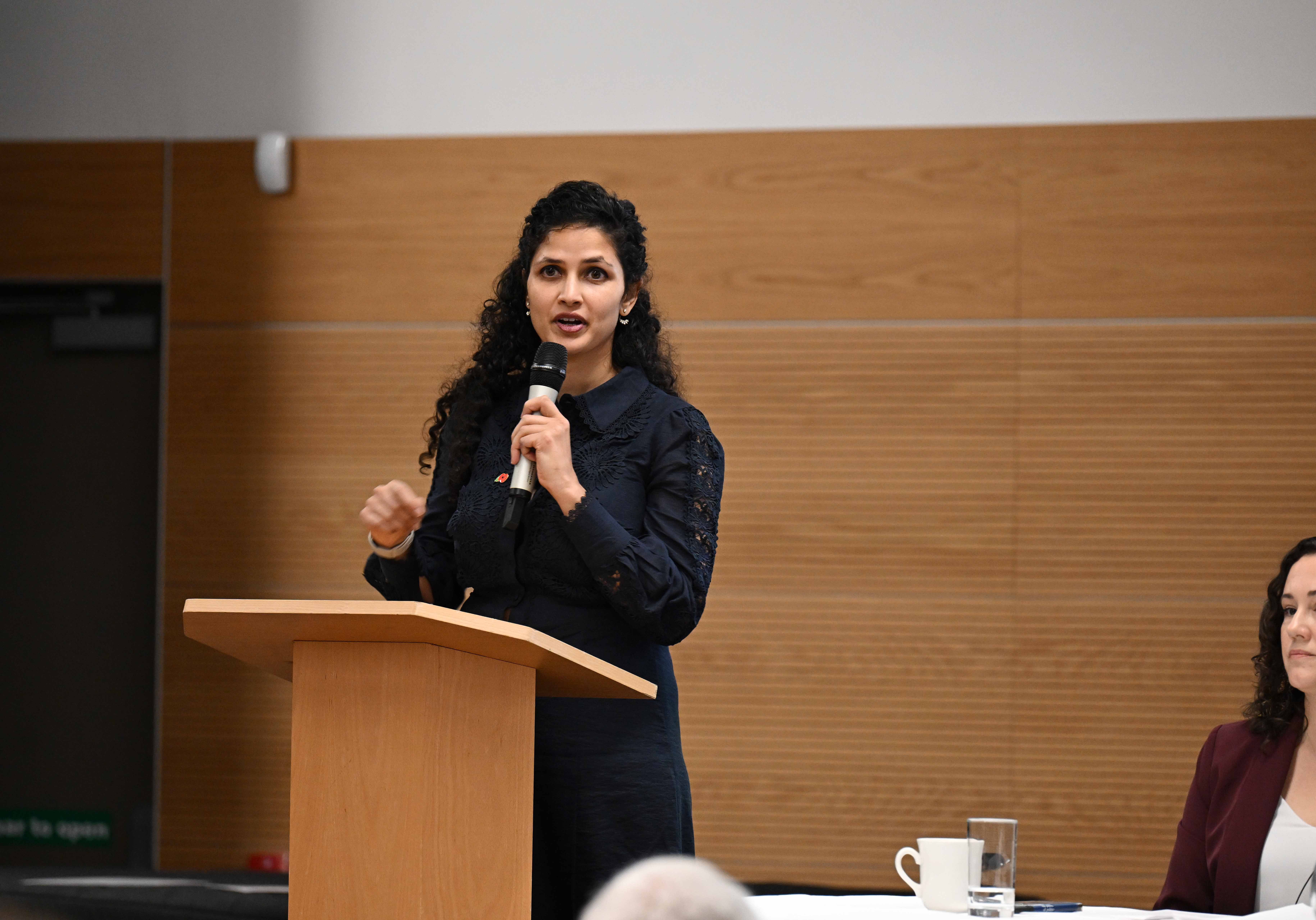 A woman standing at a podium