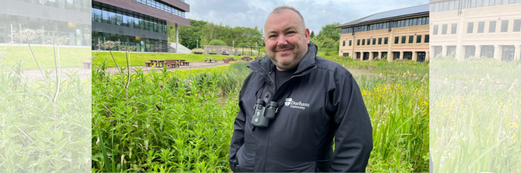 New Biodiversity Manager Ian Armstrong smiling in front of a pond