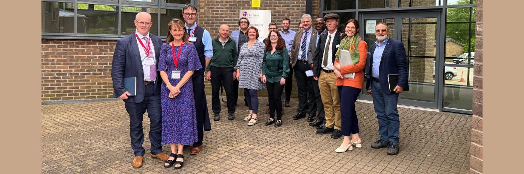 Durham University researchers with NHS visitors stood in a group smiling