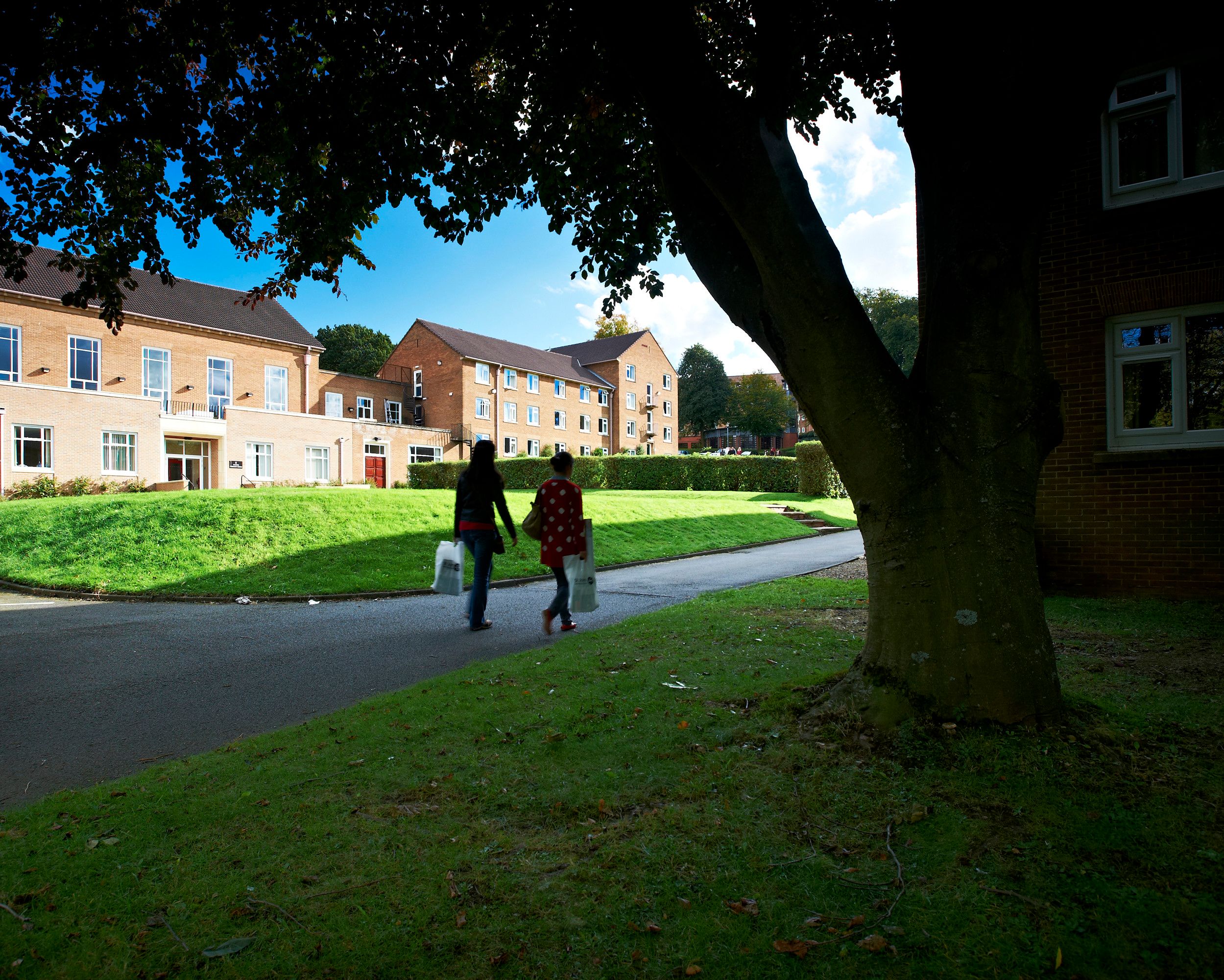 Two students walking outside Grey College