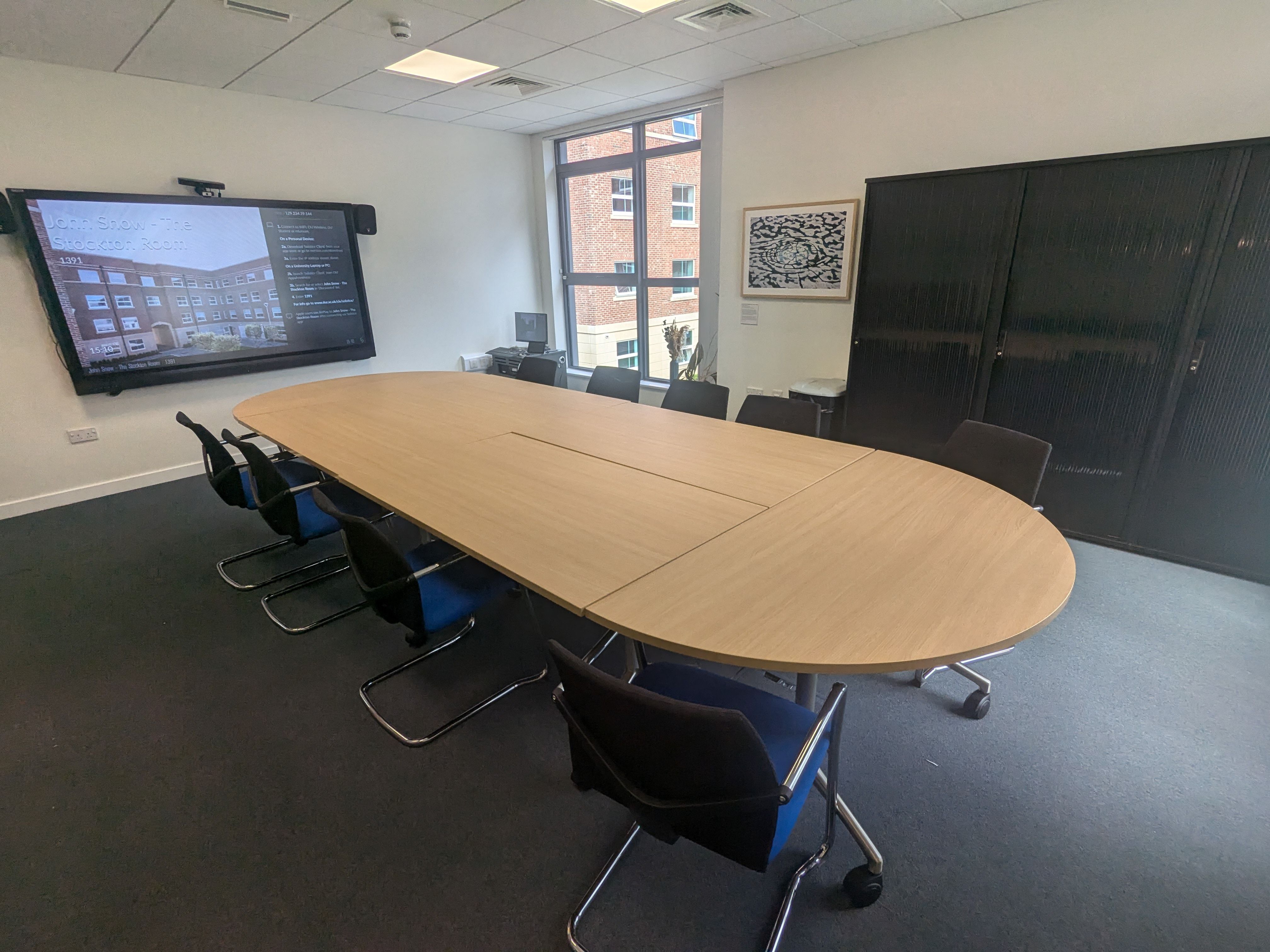 The Stockton Room showing a large boardroom style table