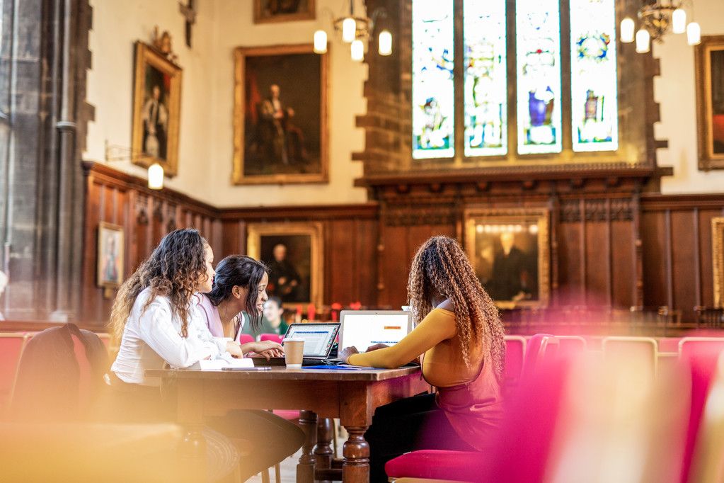 Three female students studying indoors