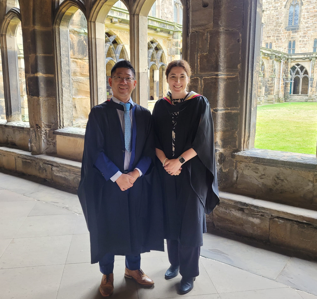 A photo of Sarah and Ocean in the cloisters at Durham Cathedral.