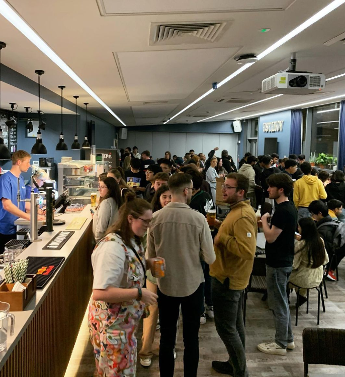 Students socialising in the college bar