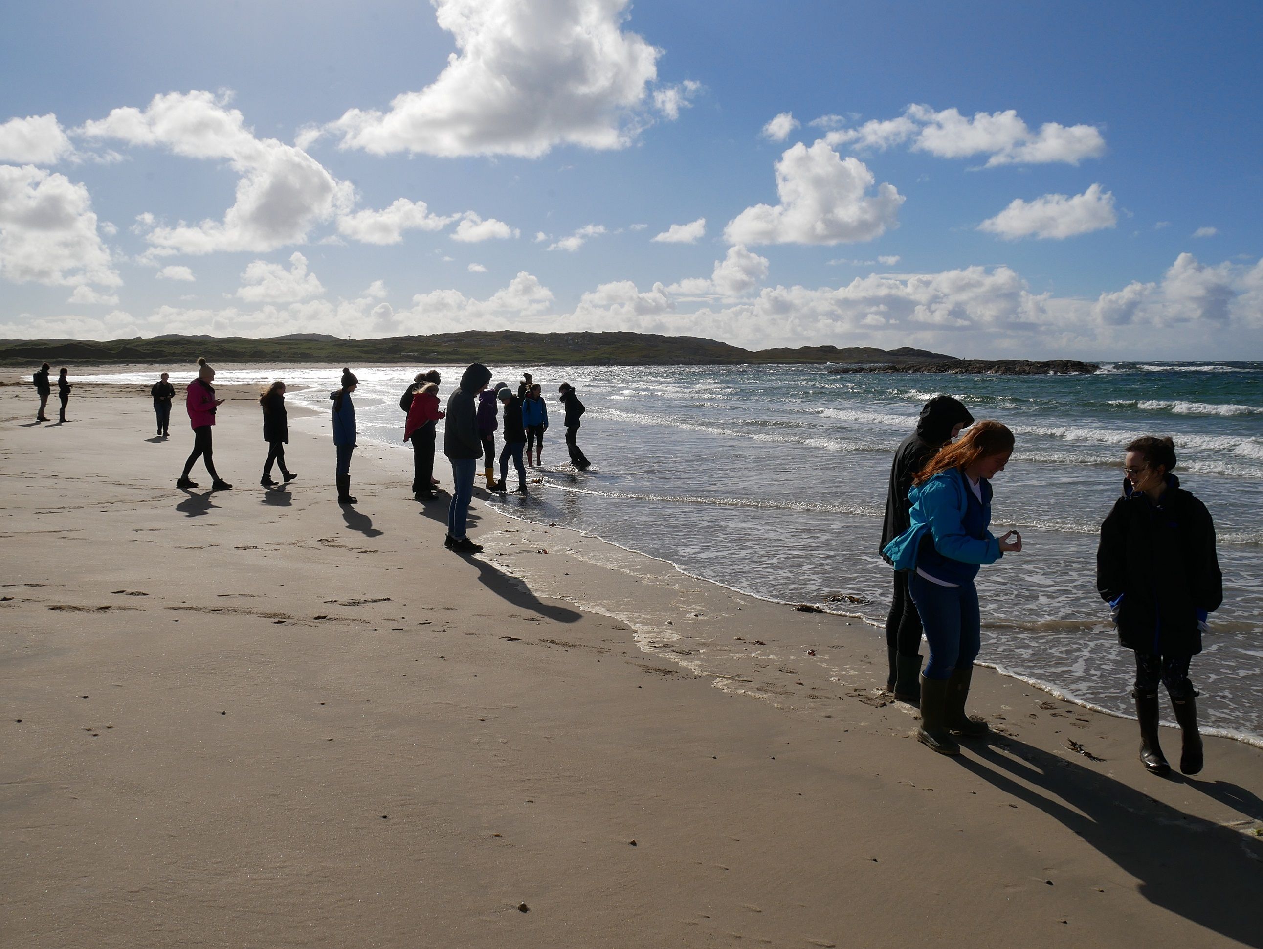 Students walking on a beach