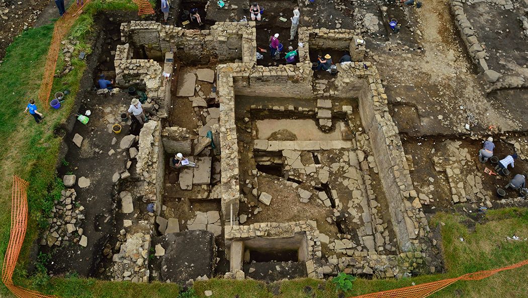 People excavating in the ruins of a roman bath house