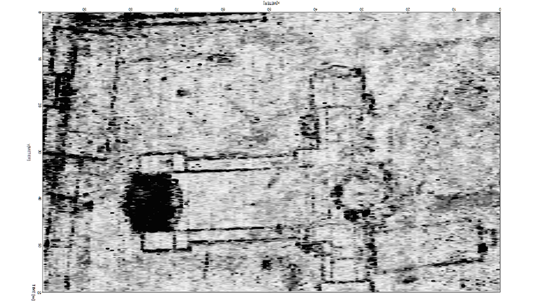 a greyscale map of gpr data showing buried archaeological features, including a former church and buildings along a street front