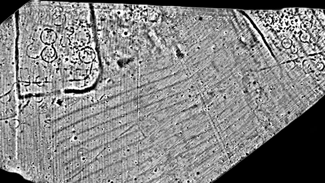 A magnetometer survey greyscale showing various ditches, roundhouses, field boundaries and furrows