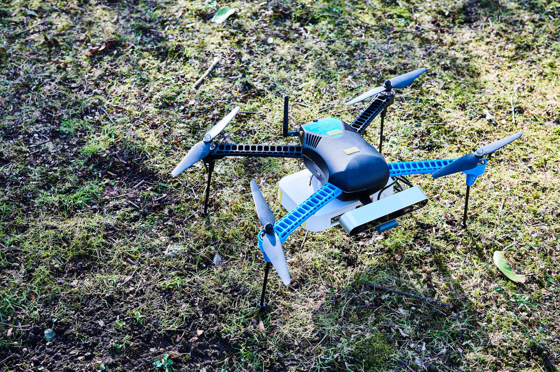 Image of a drone sitting on grass