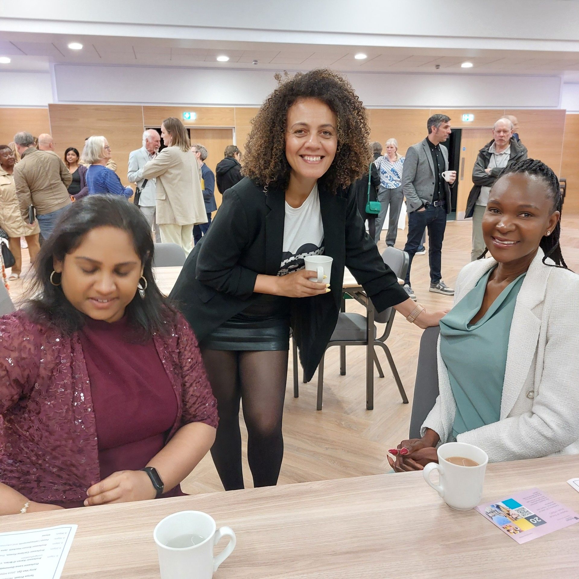 Three ladies smiling at the camera