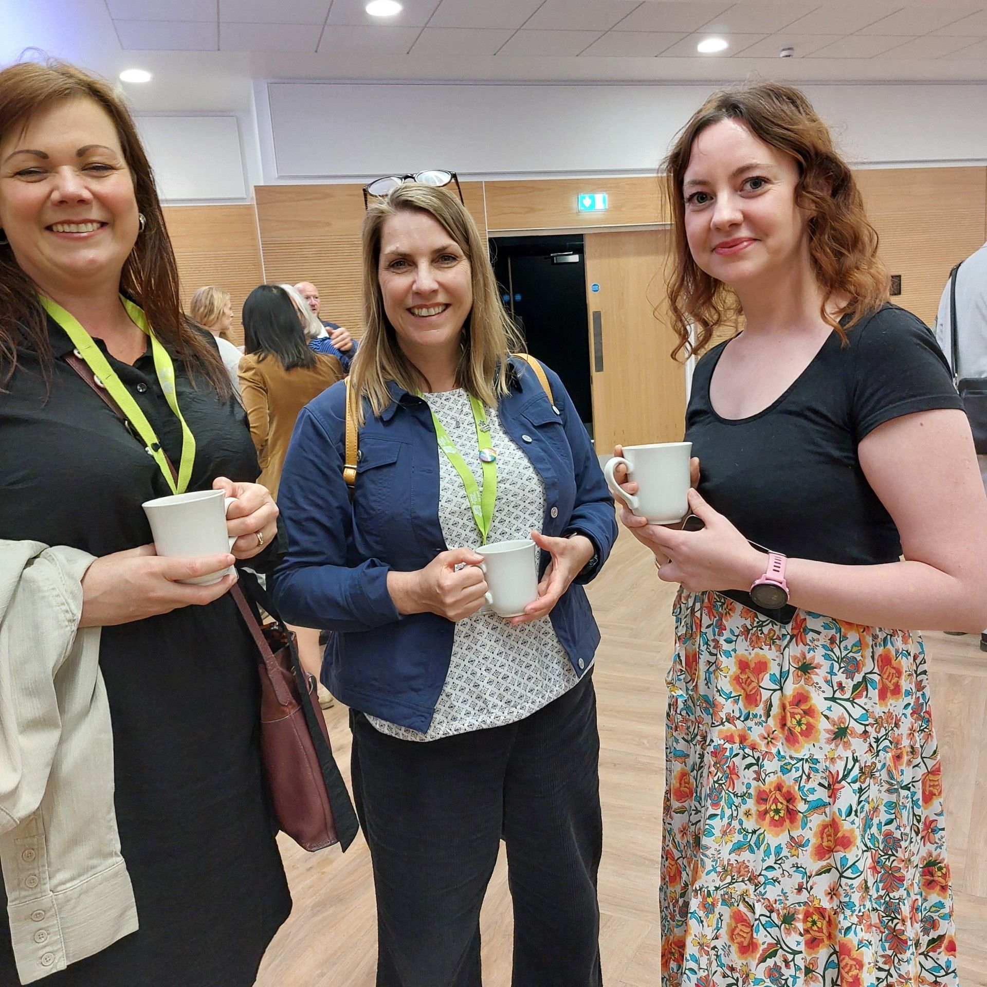 Three ladies smiling at the camera