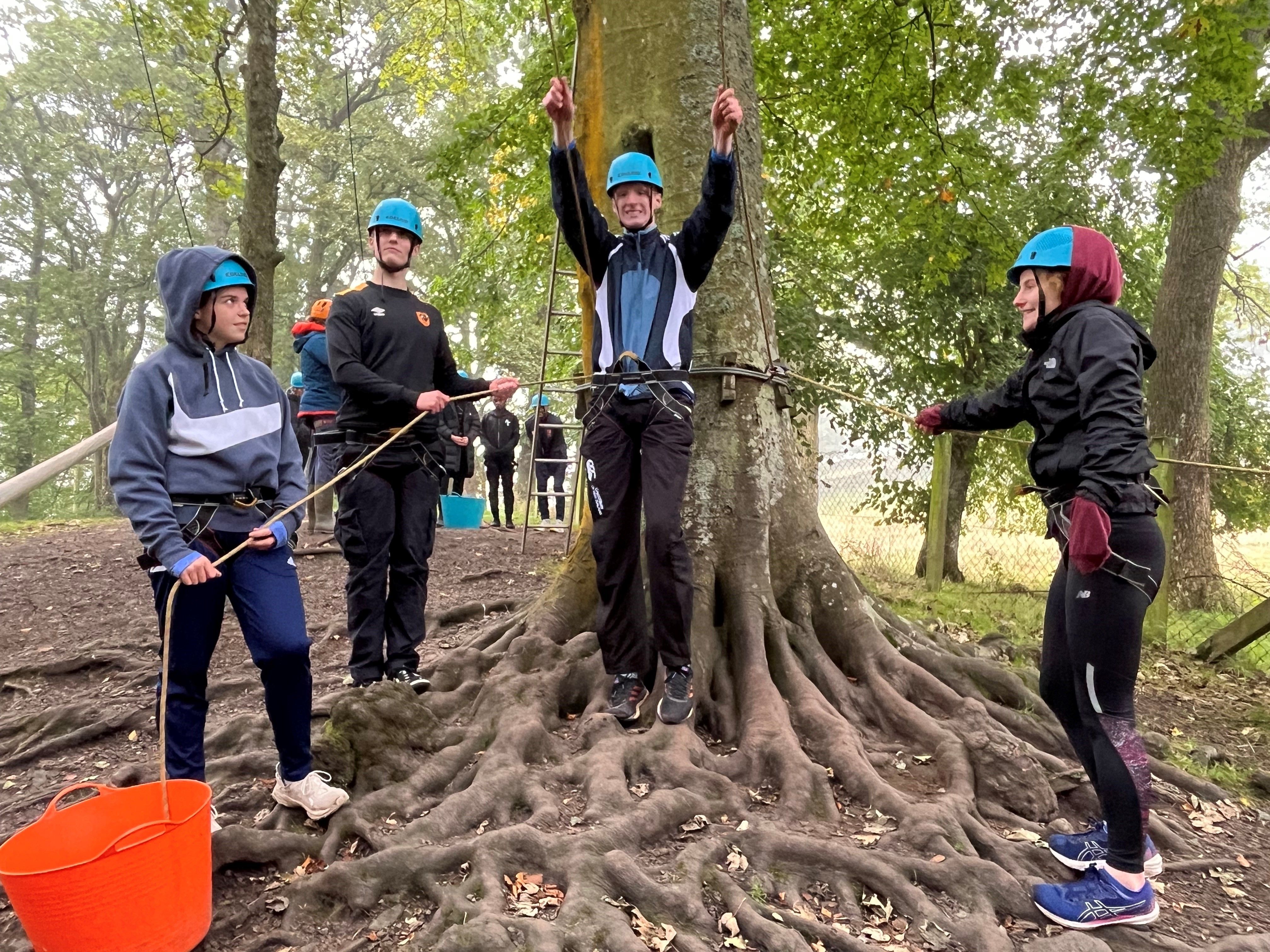 Student getting ready to participate in high ropes