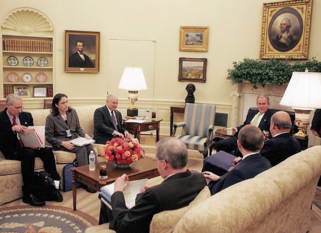 Dr Fiona Hill sitting in the Oval Office with George Bush and others