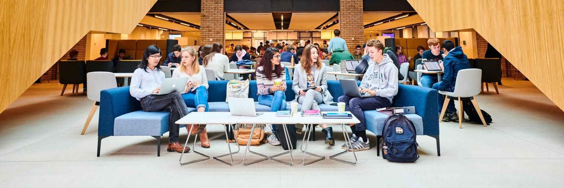 Large group of students socialising in the Teaching and Learning Centre