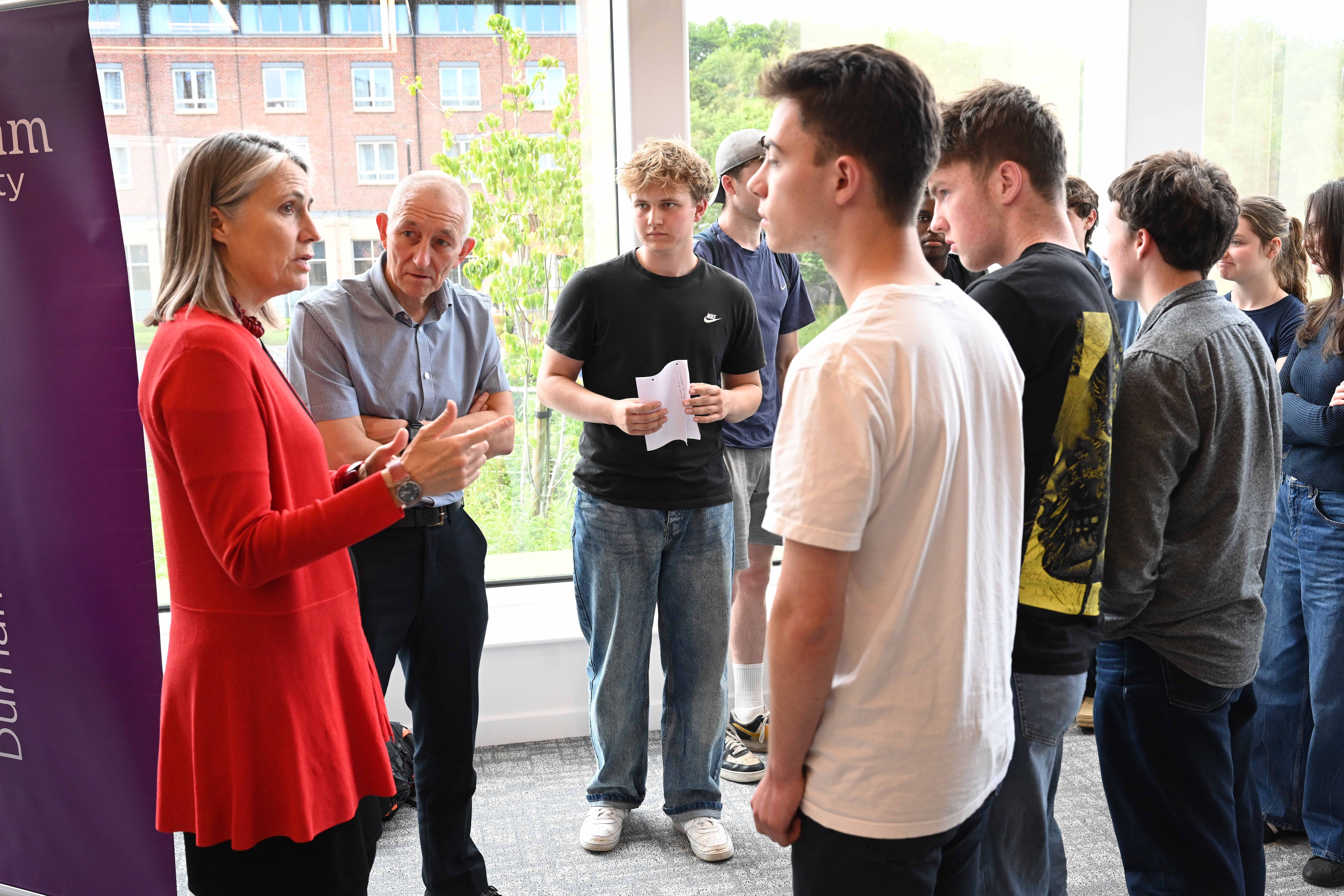 Dr Fiona Hill with students after the Chancellor in Conversation event