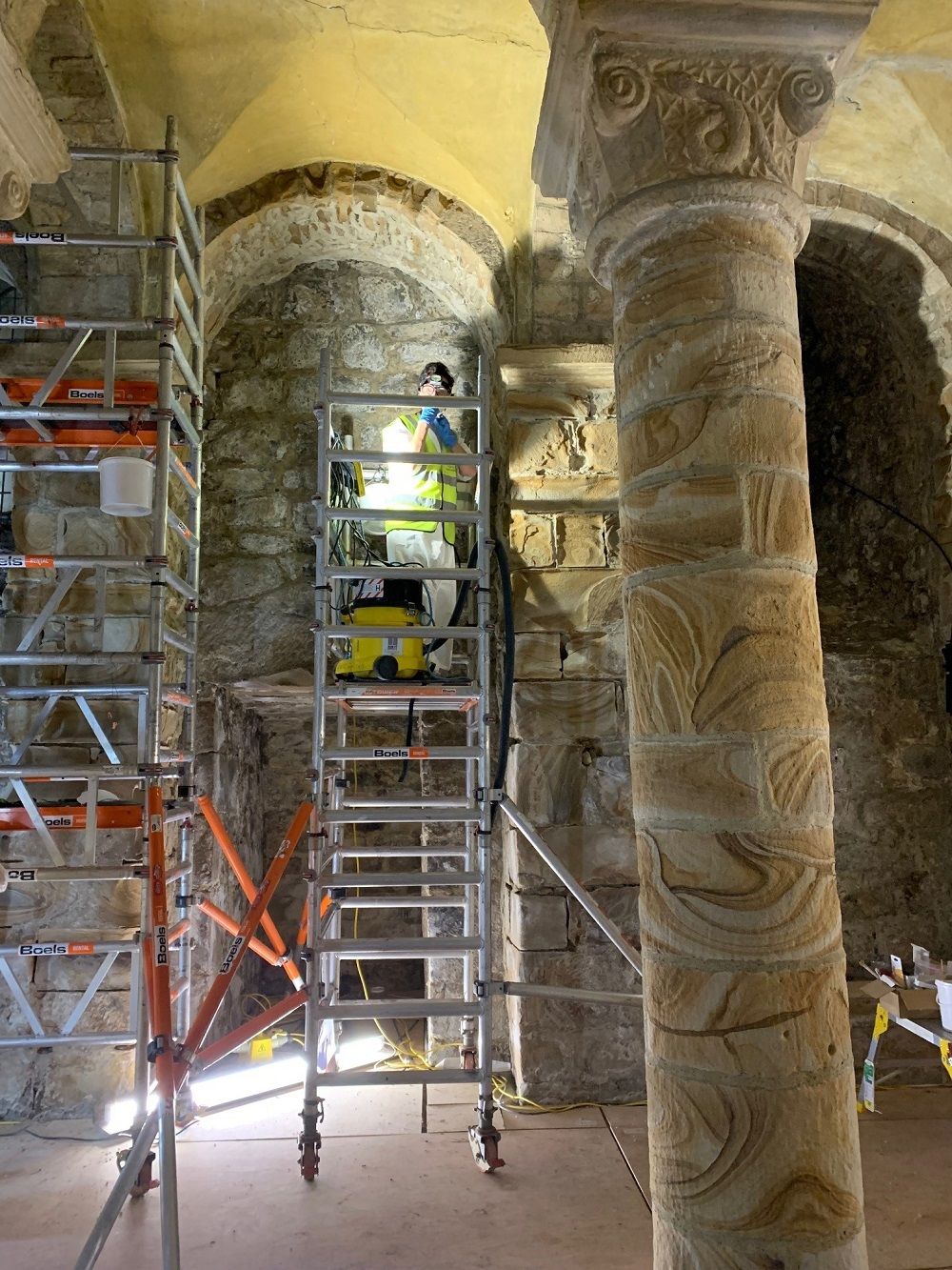 Surveying the stonework of the pillars in the Norman Chapel
