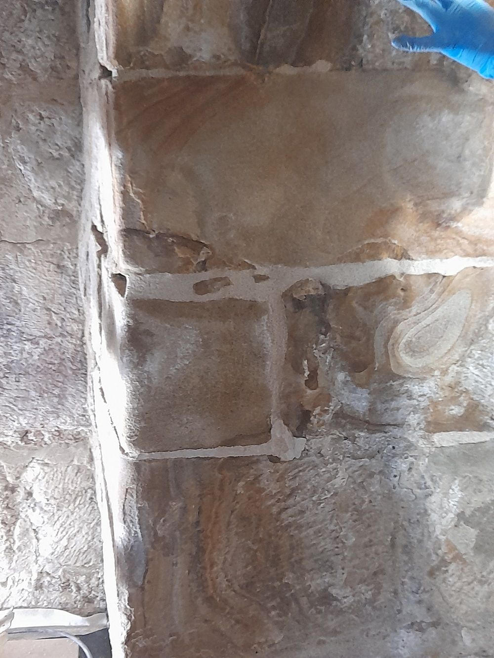 An example of the temporary mortar repairs to the pillars in the Chapel