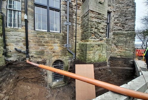 Norman Chapel Project, uncovering the window originally at ground level